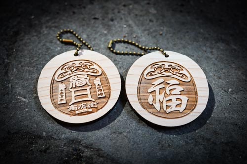 Daruma wood keychains designed by Taro for Susaki City